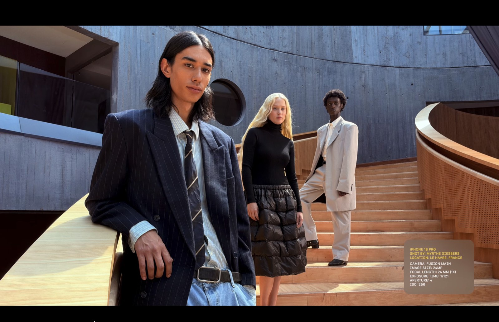 Three people at different depths on a staircase